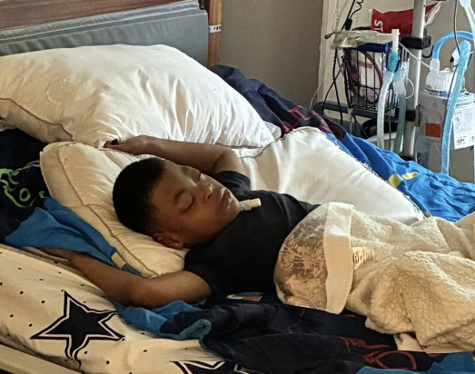 A boy sleeping in his SleepSafe bed.