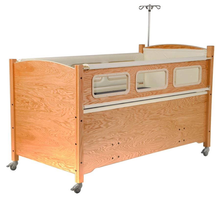 SleepSafe MEDIUM bed in oak finish with cream pads.