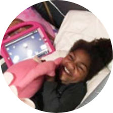 Genell lying in her SleepSafe bed.