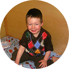 Will sitting in his SleepSafe bed.