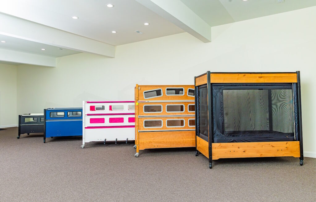 5 SleepSafe beds arranged in a line.