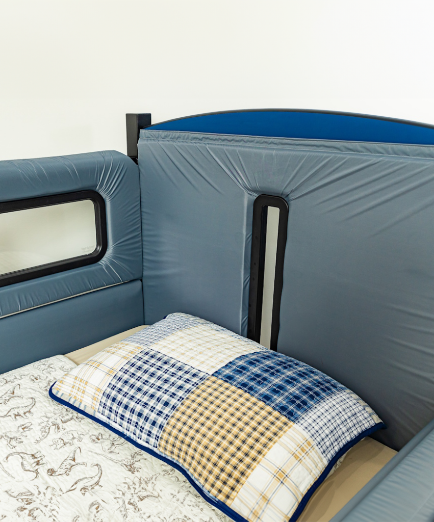 Interior of a SleepSafe bed with grey padding.