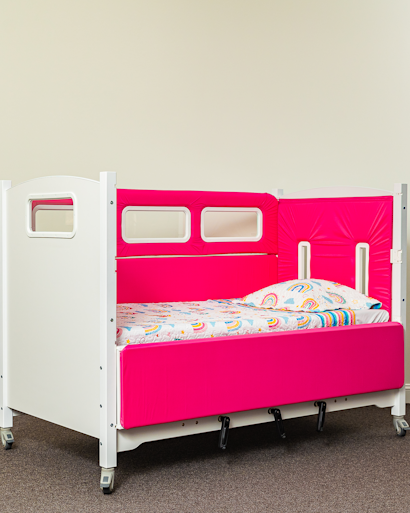 SleepSafe TALL bed with white finish and pinks pads.